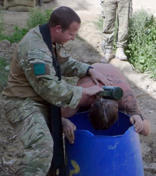 Padre Robin Richardson baptises a soldier in Afghanistan
