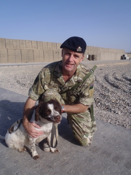 Lt Col Tim Purbrick takes Misty the search dog for a morning walk in Lashkar Gah