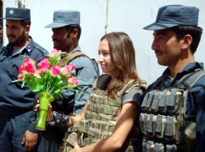 The Sun’s Defence Editor, Virginia Wheeler, is presented with flowers at Precinct 2 Police HQ in central Lashkar Gah.