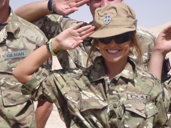 Cheryl Cole wearing the gold buttoned bracelet made by the Afghan Women's Centre in Geresk given to her by Lt Col Tim Purbrick