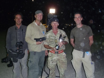Rowan Griffiths (Daily Mirror), Charlie Kinross (ITV), Lt Col Tim Purbrick with the Pride of Britain Award, and Matthew Hinchcliffe (ITV) at the Awards ceremony in Camp Bastion.