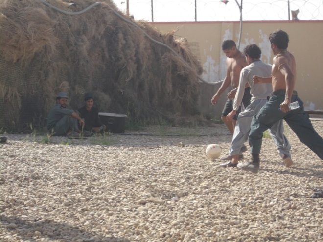 Police advisory team playing football with AUP inside Paind Kalay Police station