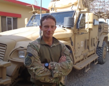 Lt Matt Galante at Paind Kalay police station with Husky vehicle in background