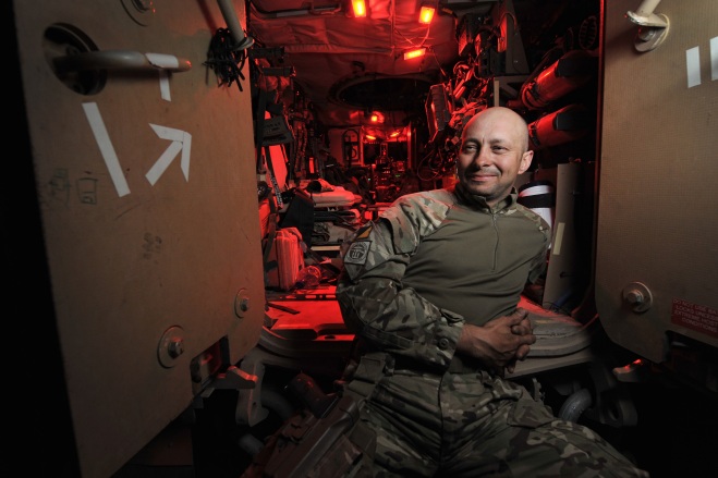 WO2 Grant Turley (41), Squadron Sergeant Major of 32 Squadron, Combat Logistic Support Regiment  relaxes on the steps of his Mastiff vehicle during a break in the Combat Logistic Patrol.